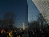 Visitors and Washington Monument Reflected in the Vietnam Memorial Photographic Print by Todd Gipstein