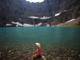 A Girl Wearing Cowboy Hat Enjoys Iceberg Lake in Glacier National Park Photographic Print by Michael Hanson