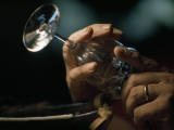 A Seneca Glass Company Wineglass in a Man's Hand Photographie par Jodi Cobb