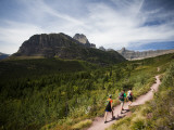 Three Hikers Walk on a Trail with Dramatic Views of Glacier Np, Mt Photographic Print by Michael Hanson