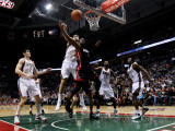 Miami Heat v Milwaukee Bucks: Andrew Bogut and Dwyane Wade Photographic Print by Jonathan Daniel