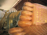A Painted Statue of a Reclining Buddha Photographic Print by Alison Wright