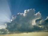 Rays of Sunlight Peek Out from Behind a Cloud Photographic Print by Jodi Cobb