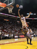 Charlotte Bobcats v Miami Heat: Dwyane Wade and Sherron Collins Photographic Print by Mike Ehrmann