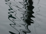 Abstract View of the Reflections of Pilings on Water Fotografie-Druck von Todd Gipstein
