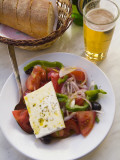 A Greek Salad, a Basket of Bread and Greek Beer Photographic Print by Richard Nowitz