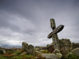 An Old Moss-Covered Cross Stands Amid Rocks in a Graveyard Photographic Print by Jim Richardson
