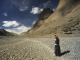 A Pilgrim Circumambulates Mount Kailas Photographic Print by Alison Wright