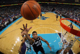San Antonio Spurs v New Orleans Hornets: Tim Duncan and David West Photographic Print by Chris Graythen