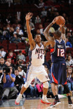 Atlanta Hawks v New Jersey Nets: Josh Powell and Derrick Favors Photographic Print by David Dow