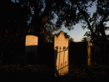 Sunlight Strikes a Tombstone at the Cemetery in Dungeness Photographie par Jodi Cobb