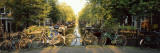 Bicycles on Bridge Over Canal, Amsterdam, Netherlands Vinilos decorativos por Panoramic Images Bicycles on Bridge Over Canal, Amsterdam, Netherlands Vinilos decorativos por Panoramic Images