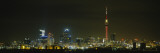 Buildings Lit Up at Night, Sky Tower, Auckland, New Zealand Vinilos decorativos por Panoramic Images Buildings Lit Up at Night, Sky Tower, Auckland, New Zealand Vinilos decorativos por Panoramic Images