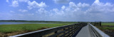 Clouded Sky over a Wooden Bridge, Myakka River State Park, Sarasota, Florida, USA Wall Decal by Panoramic Images 
