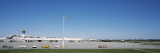 Pole and Vehicle Trailers at an Airport, Munich Airport, Munich, Bavaria, Germany Autocollant mural par Panoramic Images 