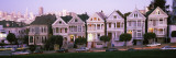 Postcard Row Houses in City, Seven Sisters, Painted Ladies, Alamo Square, San Francisco, California Autocollant mural par Panoramic Images 