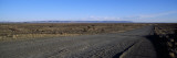 Desert Road Passing Through the Grasslands, Namibia Vinilos decorativos por Panoramic Images Desert Road Passing Through the Grasslands, Namibia Vinilos decorativos por Panoramic Images