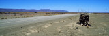 Road Sign for an Oasis, Namibia Wall Decal by Panoramic Images 