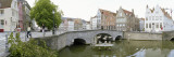 Bridge across a Channel, Bruges, West Flanders, Belgium Wall Decal by Panoramic Images 