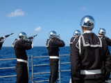 Sailors Fire a Gun Salute During a Burial-At-Sea Aboard Guided Missile Cruiser USS Bunker Hill Photographic Print by Stocktrek Images 