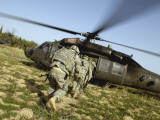 US Army Soldiers Prepare to Board a UH-60 Black Hawk Helicopter Photographic Print by Stocktrek Images 