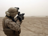 A Grenade from a M-32 Grenade Launcher Appears as a Speck Against a Bleak Sandstorm Sky Photographic Print by Stocktrek Images 