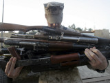 A Marine Readies 80 Pounds of Enemy Rifles Seized August 6 Photographic Print by Stocktrek Images 