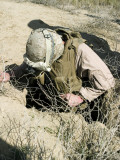 US Marine Jumps Down a Hole Next to a Farm Field North of Hit, Iraq, in Search of a Weapons Cache Photographic Print by Stocktrek Images 