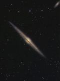 NGC 4565 is an Edge-On Barred Spiral Galaxy in the Constellation Coma Berenices Photographic Print by Stocktrek Images 
