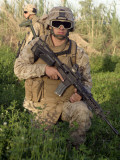 Saqlawiyah, Iraq, a Combat Engineer Assumes a Kneeling Position as He Provides Security in a Field Photographic Print by Stocktrek Images 