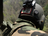 US Army National Guardsman Looks out a UH-60 Black Hawk Helicopter During a Search and Rescue Photographic Print by Stocktrek Images 