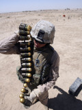 A Marine Handles a String of 40 mm High-Explosive Grenades Photographic Print by Stocktrek Images 