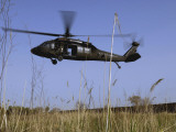 March 31, 2007, a US Army UH-60 Black Hawk Helicopter Prepares to Pick up Soldiers Photographic Print by Stocktrek Images 