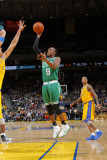 Boston Celtics v Golden State Warriors, Oakland, CA - February 22: Rajon Rondo and Andris Biedrins Photographic Print by Rocky Widner