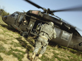 US Army Soldiers Board a UH-60 Black Hawk Helicopter Photographic Print by Stocktrek Images 