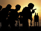 Marines Fire 9mm Handguns on the Flight Deck of USS Peleliu Photographic Print by Stocktrek Images 