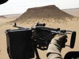 A UH-60 Blackhawk Helicopter Crew Chief Holds an M240G Medium Machine Gun During a Flight Photographic Print by Stocktrek Images 