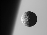 This Amazing Perspective View Captures Battered Moon Mimas Against the Hazy Limb of Planet Saturn Photographic Print by Stocktrek Images 
