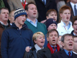 Prince William sings the National Anthem still wearing his wooly hat while his brother Harry does t Fotografisk tryk Prince William sings the National Anthem still wearing his wooly hat while his brother Harry does t Fotografisk tryk
