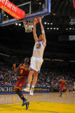 Cleveland Cavaliers  v Golden State Warriors, Oakland, CA - January 7: David Lee Photographic Print by Rocky Widner