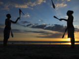 Silhouetted Jugglers on the Beach Photographic Print by Christian Aslund