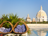 Hotel Charleston Cartagena Towels with Dome of San Pedro Claver Church Reflected in Water Photographic Print by Jane Sweeney