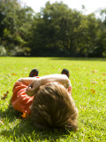 Child Relaxing in Royal Botanic Gardens Photographic Print by Greg Elms