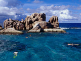 Snorkellers Near Granite Outcrops Photographic Print by Jean-Bernard Carillet