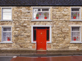 Red Door and Red Flowers in Window Photographic Print by Holger Leue