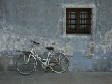 Bicycle Against Chipped Wall Photographic Print by Guylain Doyle