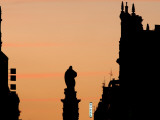 Statue of Guzman El Bueno with Illuminated Hotel Sign at Sunset from Plaza Santo Domingo Fotografisk trykk av David Borland