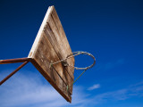 Basketball Net Against Blue Sky Photographic Print by Kimberley Coole