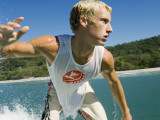 Surfer Riding a Wave Photographic Print by Christian Aslund