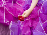 Costumed Girl Holding Rose at Madeira Flower Festival Parade Photographie par Holger Leue